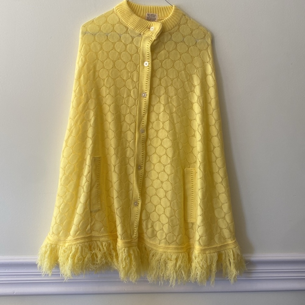 Vintage yellow poncho cape with fringe.